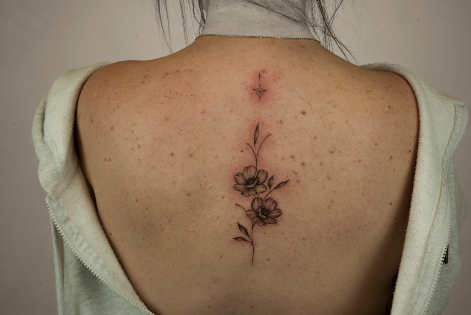 Fine-line tattoo by Studio KEJ